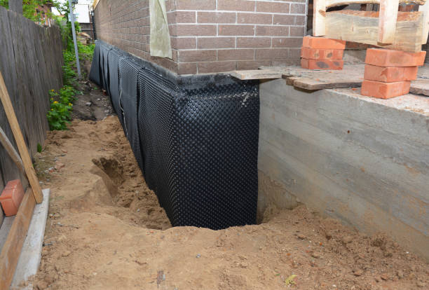Happy homeowners after waterproofing job in Augusta